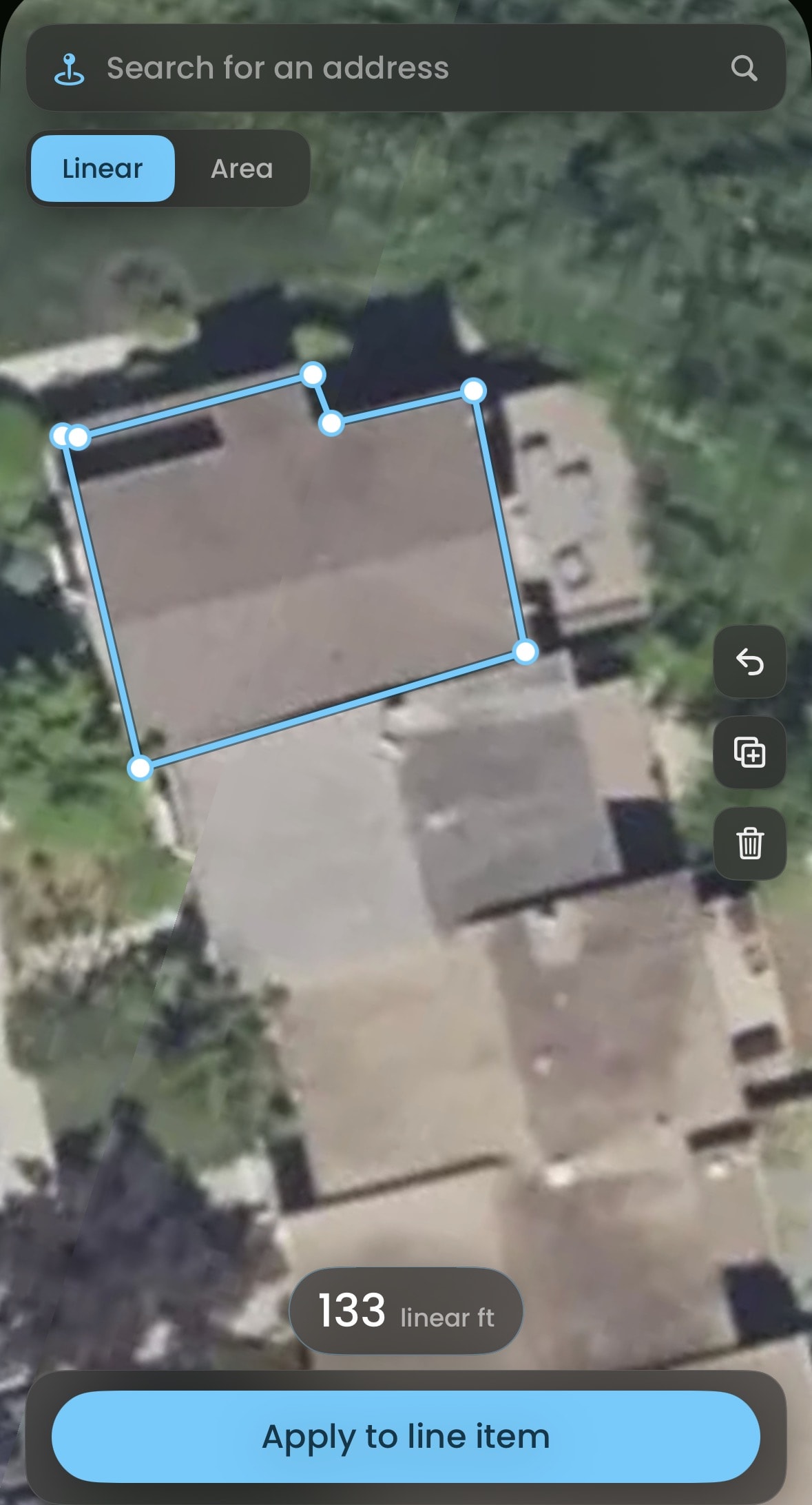 The satellite measure tool tracing a property into line items.